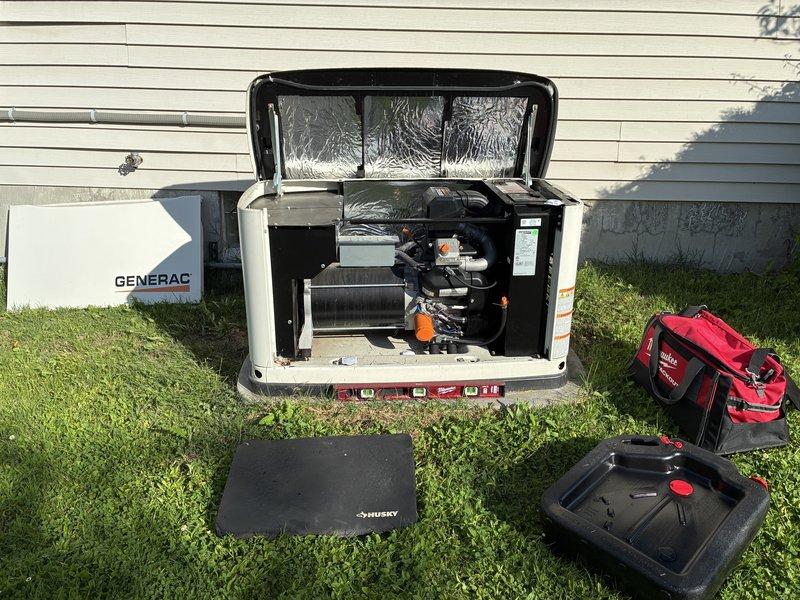 Performed scheduled maintenance on a Generac 20kW standby generator unit. Conducted comprehensive inspection of engine components, electrical connections, and control systems with access panel fully opened for thorough examination. Verified proper operation of cooling systems, fuel lines, and internal wiring. Inspected exterior conduit connections to main electrical panel and transfer switch equipment. Completed routine maintenance procedures including fluid level checks and system diagnostics to ensure reliable backup power operation.
