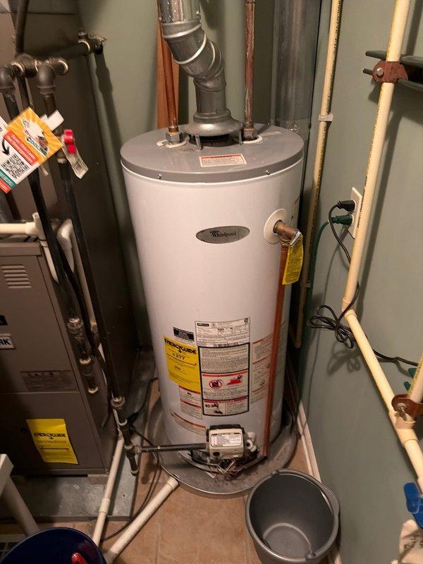 Responded to service call for H-S Craftmaster tanked water heater (Model N40S91-403) with non-functioning pilot light and igniter assembly. Upon initial inspection, diagnosed faulty igniter component preventing flame ignition. Ordered replacement parts, which arrived and were staged for second appointment. Returned to property, installed new igniter assembly, tested pilot light operation, and verified proper burner ignition sequence. Confirmed water heater restored to full operational status with adequate hot water production.