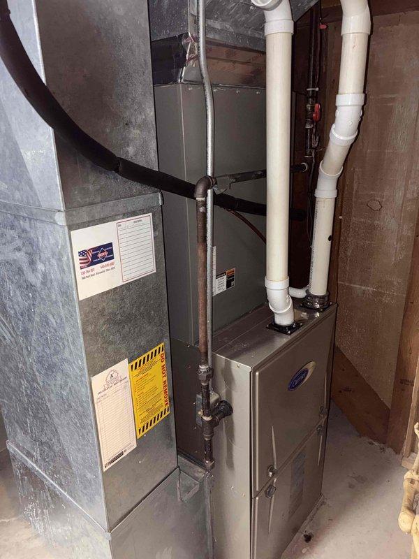 # HVAC Maintenance - Cooling

Performed comprehensive annual preventive maintenance on residential split system air conditioning unit. Conducted thorough inspection of indoor air handler and evaporator coil assembly located in basement utility area. Verified proper operation of blower motor and checked airflow across evaporator coil. Inspected condensate drain lines and confirmed proper drainage through PVC piping system.

Accessed electrical control compartment and performed detailed inspection of all components. Tested dual-run capacitor for proper microfarad readings and verified contactor operation. Inspected all electrical connections, including compressor circuit wiring with multiple conductor runs. Confirmed all wire terminations were secure and free from signs of overheating or corrosion. Verified safety controls and relay functions operating within manufacturer specifications.

System found to be in good operating condition consistent with 3-year-old equipment. All components 