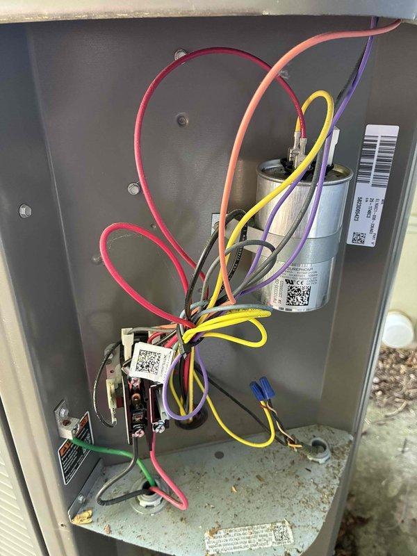 # HVAC Maintenance - Cooling

Performed comprehensive annual preventive maintenance on residential split system air conditioning unit. Conducted thorough inspection of indoor air handler and evaporator coil assembly located in basement utility area. Verified proper operation of blower motor and checked airflow across evaporator coil. Inspected condensate drain lines and confirmed proper drainage through PVC piping system.

Accessed electrical control compartment and performed detailed inspection of all components. Tested dual-run capacitor for proper microfarad readings and verified contactor operation. Inspected all electrical connections, including compressor circuit wiring with multiple conductor runs. Confirmed all wire terminations were secure and free from signs of overheating or corrosion. Verified safety controls and relay functions operating within manufacturer specifications.

System found to be in good operating condition consistent with 3-year-old equipment. All components 