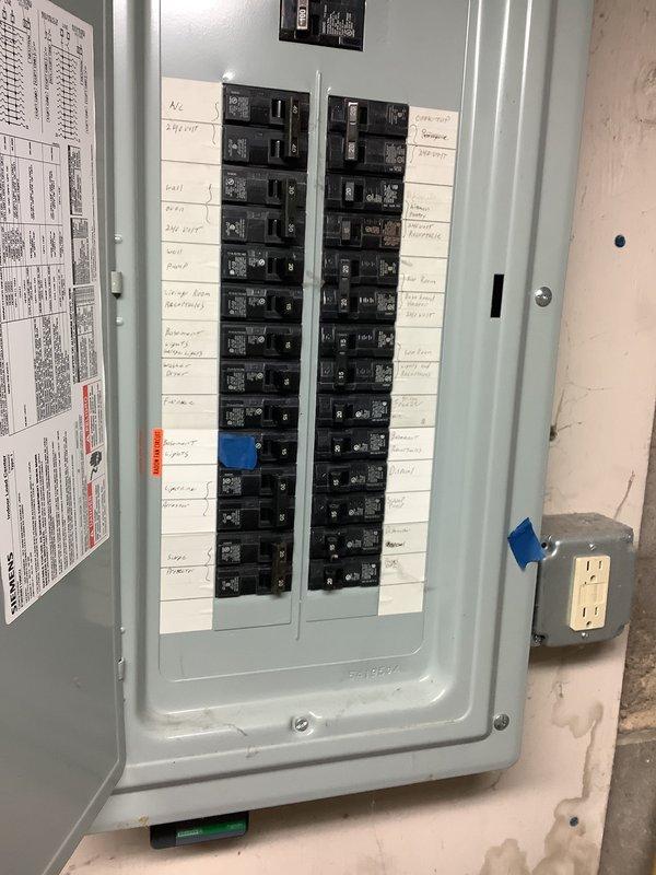 Conducted on-site assessment for HVAC system replacement, documenting existing electrical infrastructure including main breaker panel configuration and exterior electrical disconnect box. Photographed current equipment locations and electrical connections to prepare comprehensive replacement estimate for new air conditioning system installation.