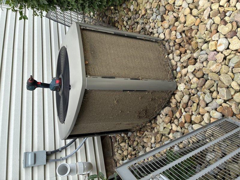 Completed MVP cooling maintenance visit on outdoor condensing unit. Performed visual inspection of equipment exterior, verified unit positioning on concrete pad with rock landscaping, and documented current condition of coil surfaces and fan assembly. Unit operational with minor dirt accumulation noted on filter panel requiring standard cleaning during next service interval.