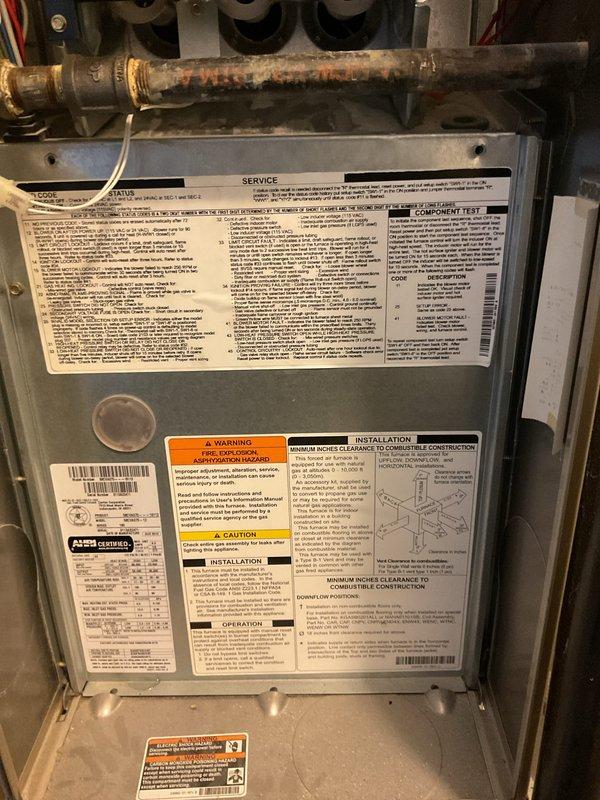 Responded to no cooling complaint at rental property. Upon inspection, found central A/C system with refrigerant issue indicated by accessible service ports on suction and liquid lines. Evaluated system components including furnace air handler and refrigerant piping connections. System assessed and documented for property management records.