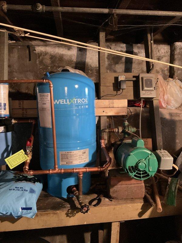 Installed complete water treatment system for well water with iron content below 2.5-3 ppm. System includes wall-mounted iron filter with pre and post isolation valves, metered water softener equipped with 2510 mechanical control head and bypass valve assembly, and upgraded brine tank with grid system. All components connected via copper piping to existing well pressure tank system. System sanitized, tested, and commissioned. Salt supply provided and system staged for operation.