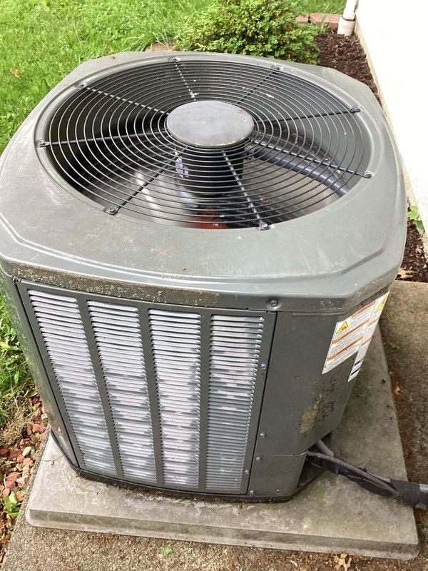 Completed air conditioning maintenance on outdoor condenser unit of unknown age. Performed standard system inspection and tune-up procedures. Evaluated ductwork condition for potential cleaning needs. Unit found in functional operating condition with normal outdoor weathering present. Temperature measurements taken at air handler to verify system performance parameters.