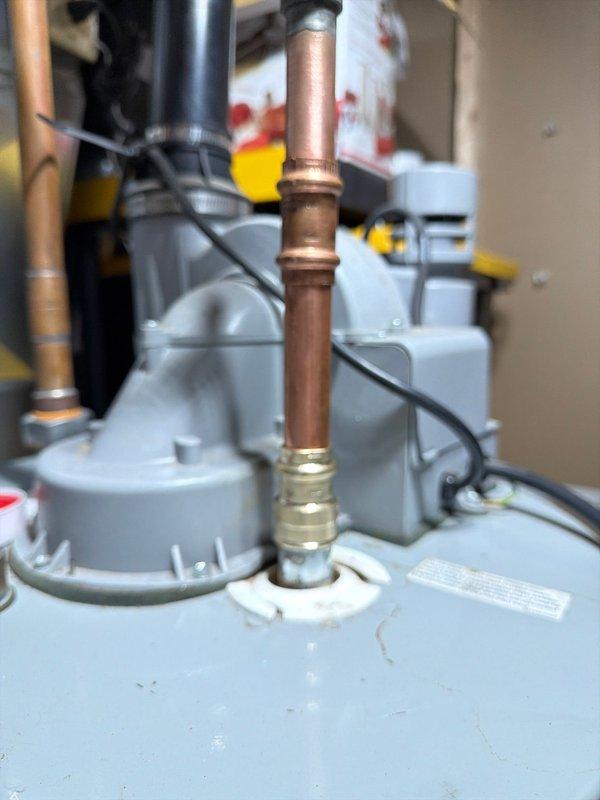 Responded to service call for leaking electric water heater in 22-year-old residential property. Upon inspection, identified active leak at dielectric union connection on hot water outlet. Per customer request, replaced both hot and cold side dielectric unions and installed new insulating nipples to prevent galvanic corrosion and extend equipment lifespan. Inspected and replaced anode rod due to age and deterioration. Verified all connections for proper seal, tested system operation, and confirmed no active leaks present upon completion.