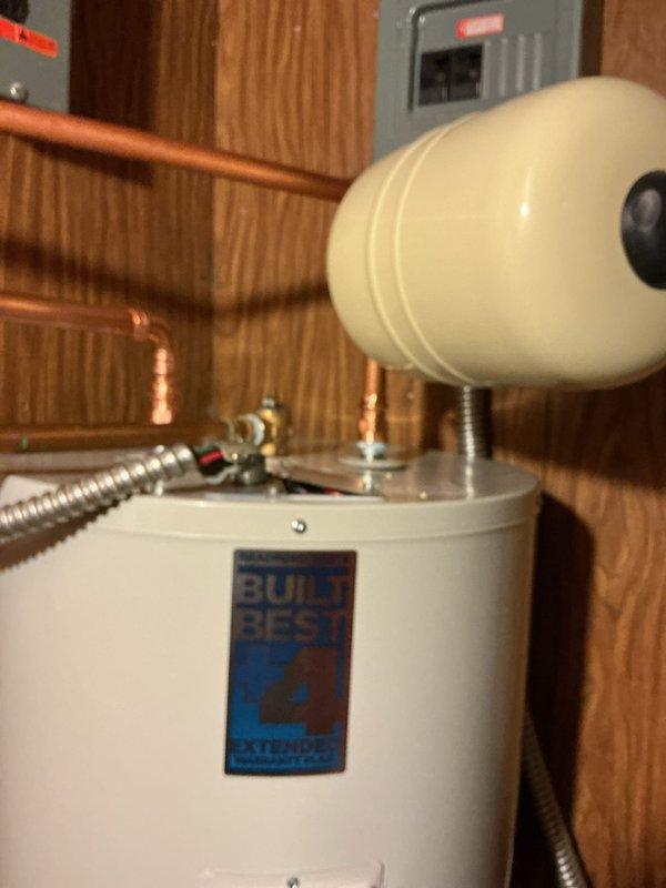Replaced existing 80-gallon electric water heater with new 50-gallon Bradford White electric unit including 10-year warranty. Installed expansion tank and complete water heater kit with all necessary connections. Removed old unit, installed new water heater with proper copper piping connections, flexible connectors, shut-off valves, and electrical hookup to existing breaker panel. All plumbing connections tested and verified operational upon completion.