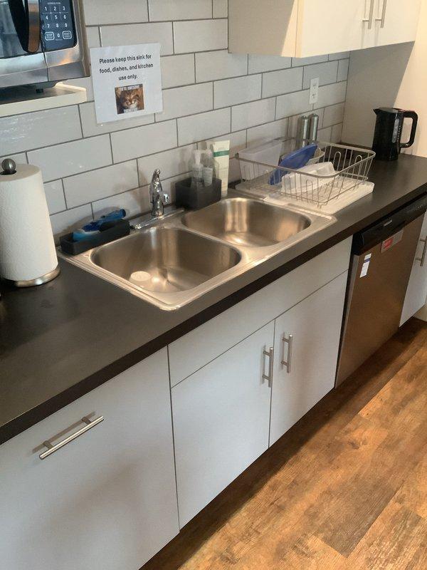 Conducted on-site consultation for reverse osmosis system installation in residential kitchen. Assessed existing under-sink plumbing configuration, including garbage disposal, drain trap assembly, and current water supply connections to determine optimal placement and integration requirements for RO unit. Provided estimate for complete system installation with waived consultation fee.
