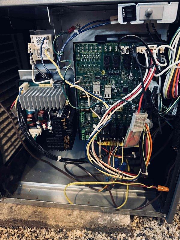 Completed MVP cooling maintenance visit on system control board and electrical components. Performed diagnostic testing using digital multimeter, recording voltage reading of 338.3V on system circuit board. Inspected main control board assembly, verifying proper operation of all electronic components, wire harnesses, heat sink assembly, and power supply connections.