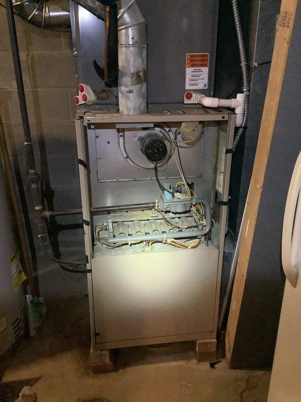 Responded to service call for 5-year-old A/C system with reported burning smell during operation. Performed comprehensive system inspection of both indoor furnace unit and outdoor condenser. Evaluated electrical components, control board, blower motor assembly, and wiring connections for signs of overheating or failure. Documented equipment condition with photographs for service records.