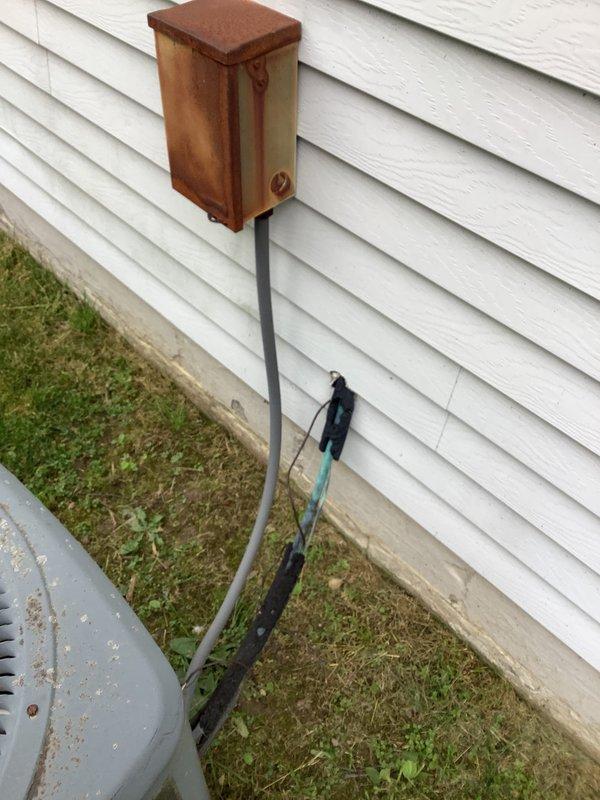 Conducted comprehensive site assessment for complete HVAC system replacement including air conditioning condenser unit and air handler located in attic space. Evaluated existing Goodman outdoor condenser unit, electrical disconnect box with visible weathering and oxidation, refrigerant line set, and condensate drainage system with safety switch. Accessed attic-mounted air handler through interior closet using customer-provided ladder to assess ductwork configuration, clearances, and installation requirements. Documented existing equipment conditions, electrical service connections including conduit routing and ground-level wiring terminations, and concrete pad placement. Photographed all system components and utility connections to develop accurate replacement specifications and provide detailed estimate for new equipment installation.