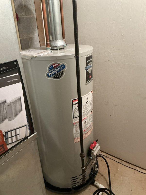 Completed flush and fill maintenance procedure on HydroJet residential tanked water heater. Drained sediment buildup from tank bottom, flushed system with fresh water supply, and refilled unit to restore optimal operating efficiency and extend equipment lifespan.