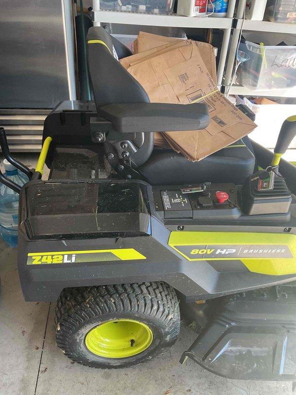 Responded to report of circuit breaker tripping when equipment was plugged into outlets throughout the residence. Upon investigation, identified an 80V electric riding lawn mower being charged via a power strip in the garage as the source of the electrical overload. The power strip was inadequate for the high amperage draw required by the mower's battery charging system, causing repeated breaker trips that affected multiple circuits. Advised customer on proper charging procedures using a dedicated outlet and circuit appropriate for the equipment's electrical requirements. Inspected and provided estimate for replacement of a GFCI outlet as requested. Verified electrical system functionality after disconnecting the overloading equipment and confirmed no damage to existing circuits or breaker panel.