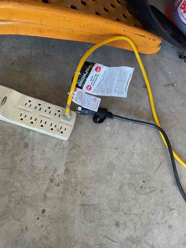 Responded to report of circuit breaker tripping when equipment was plugged into outlets throughout the residence. Upon investigation, identified an 80V electric riding lawn mower being charged via a power strip in the garage as the source of the electrical overload. The power strip was inadequate for the high amperage draw required by the mower's battery charging system, causing repeated breaker trips that affected multiple circuits. Advised customer on proper charging procedures using a dedicated outlet and circuit appropriate for the equipment's electrical requirements. Inspected and provided estimate for replacement of a GFCI outlet as requested. Verified electrical system functionality after disconnecting the overloading equipment and confirmed no damage to existing circuits or breaker panel.