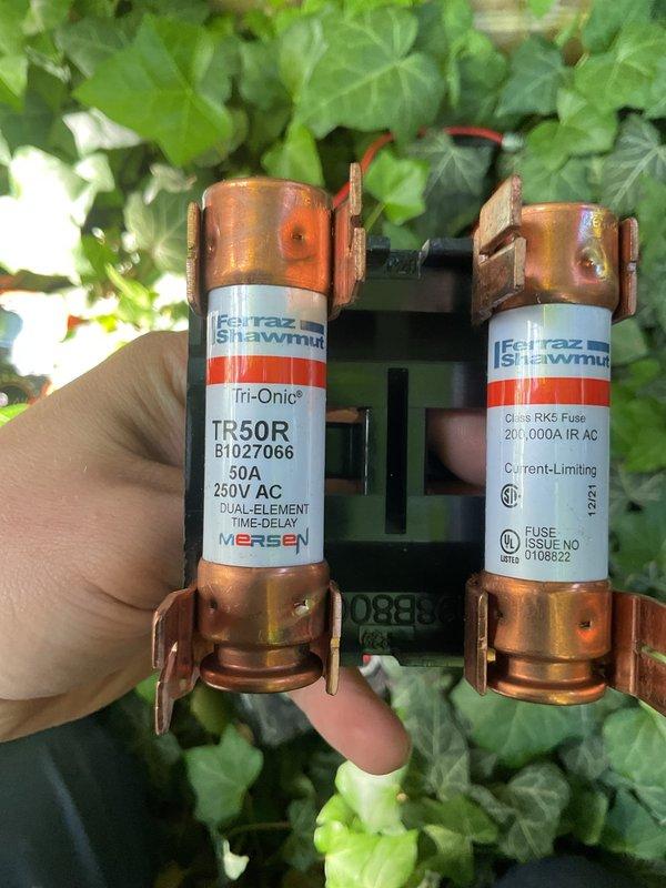 Completed routine maintenance inspection on three-year-old air conditioning system. Identified and replaced failed 30-amp dual-element time-delay fuse in outdoor condenser unit disconnect, restoring power to the system. Inspected condenser unit exterior, refrigerant line insulation, and mounting pad; all components found in satisfactory condition with normal operational wear.