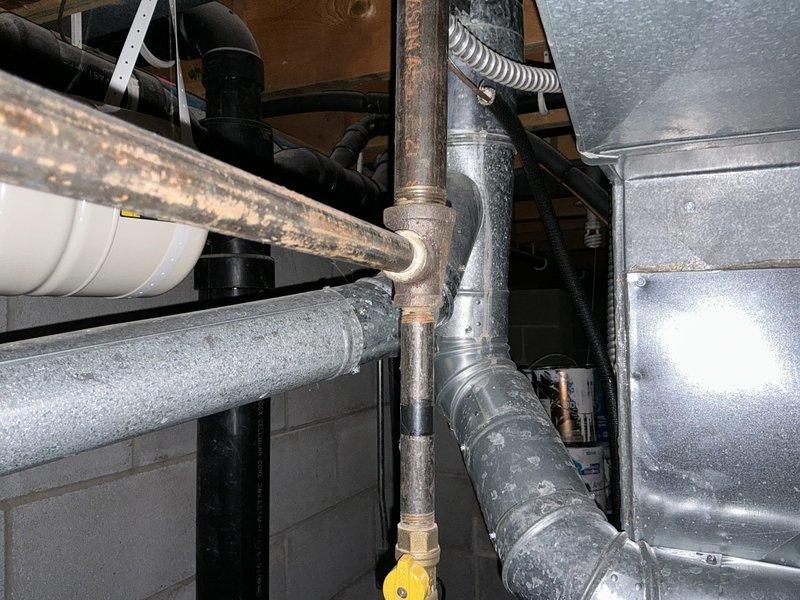Conducted comprehensive assessment of existing Trane furnace and air conditioning system for replacement estimate. Documented current equipment condition, including furnace unit with operational ventilation louvers, associated ductwork, gas line connections, and aged copper piping showing normal wear. Customer requested competitive pricing comparison for complete HVAC system replacement.