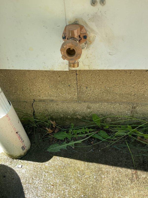 Replaced exterior sillcock with new Woodford frost-free hose bib. Accessed plumbing lines through ceiling panel near driveway area to complete installation. Parts were ordered and received prior to completing the repair, ensuring proper freeze-proof protection for the exterior water connection.