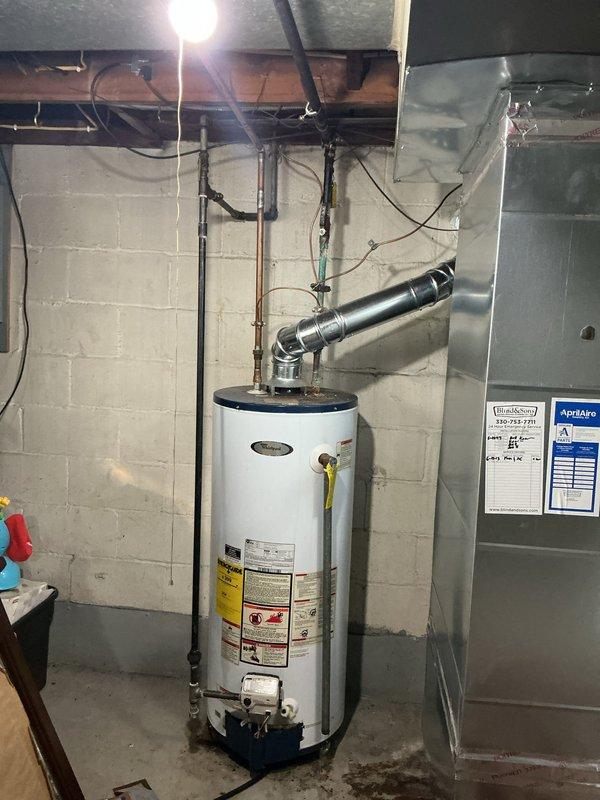 Responded to callback for reported leak on previously repaired pipe. Upon arrival, conducted thorough inspection of water heater piping system and surrounding copper plumbing connections in basement mechanical room. Examined all joints, fittings, and connections on water heater inlet and outlet lines, as well as overhead distribution piping. Verified system pressure and checked for active leaks or moisture accumulation. Documented current condition of water heater installation, associated piping, and HVAC equipment in vicinity with photographic evidence for service records. All connections inspected and found to be dry with no visible signs of active leakage at time of inspection.