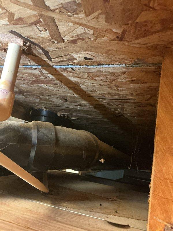 Responded to service call for water backing up in basement with suspected sump pump issue. Upon arrival, performed thorough inspection of crawl space and basement area to identify source of water intrusion. Examined subfloor structure, exposed joists, and plumbing infrastructure including visible PVC piping and drainage systems. Documented significant deterioration of subflooring materials with evidence of moisture damage, delamination, and structural degradation consistent with ongoing water exposure. Identified compromised building materials and potential water infiltration points requiring further assessment and remediation.