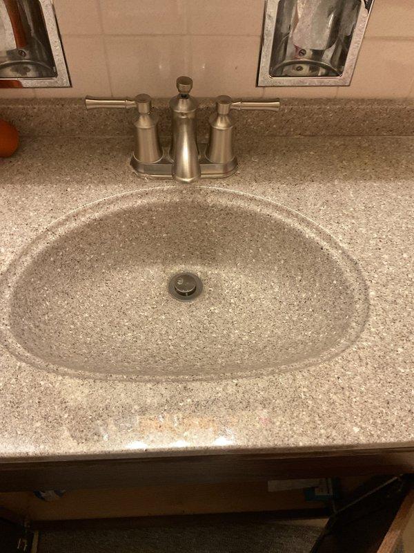 Responded to a recurring drain backup issue affecting the basement main drain line and half bathroom fixtures. Upon arrival, confirmed standing water and slow drainage in the basement bathroom sink and toilet. Performed drain cleaning service using appropriate equipment to clear the blockage from the main line. Tested all affected fixtures to verify proper drainage and flow restoration. System returned to normal operation with no further backup observed.
