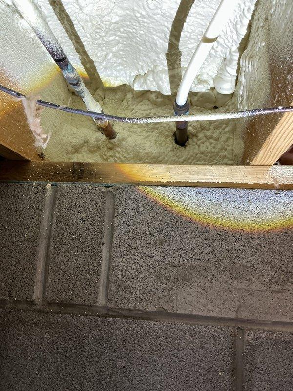 Responded to service call for leaking exterior cold water spigot. Upon arrival, found hose stuck on the leaking spigot and confirmed shut-off valves in crawlspace had already been turned off by property owner. Accessed crawlspace to inspect plumbing infrastructure and shut-off valve locations. Successfully removed stuck hose from spigot coupling. Assessed spigot condition and determined source of leak. Documented existing plumbing configuration including hot and cold water exterior faucet locations and crawlspace valve access points for future reference.