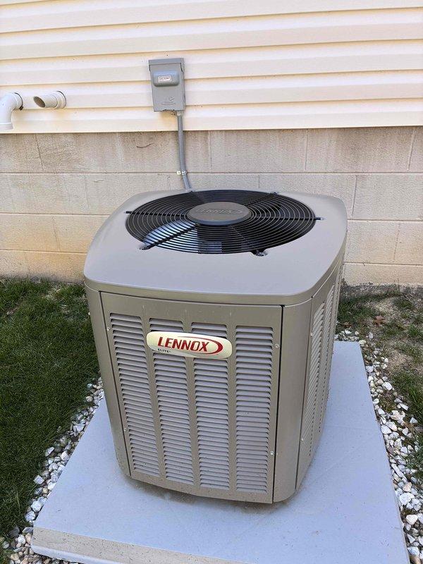 Completed MVP cooling maintenance visit on Lennox outdoor unit. Inspected condenser coil and found significant accumulation of dirt, dust, debris, and organic matter blocking airflow through fins, particularly heavy on right side and bottom sections. Cleaned condenser coil to restore proper heat transfer efficiency and system performance. Verified unit operation, electrical disconnect, and proper installation on concrete pad with adequate clearances.