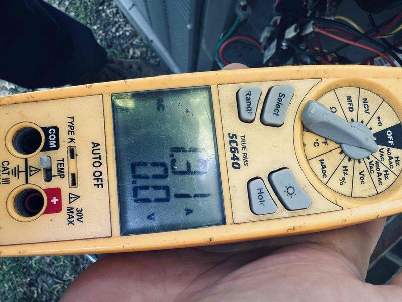 Completed preventive maintenance inspection on residential cooling system. Performed electrical diagnostics using digital multimeter, recording system voltage and verifying proper electrical operation of outdoor condensing unit. Inspected exterior condenser unit including fan assembly, refrigerant line connections, and electrical conduit routing along building exterior. System operating within normal parameters at time of inspection.