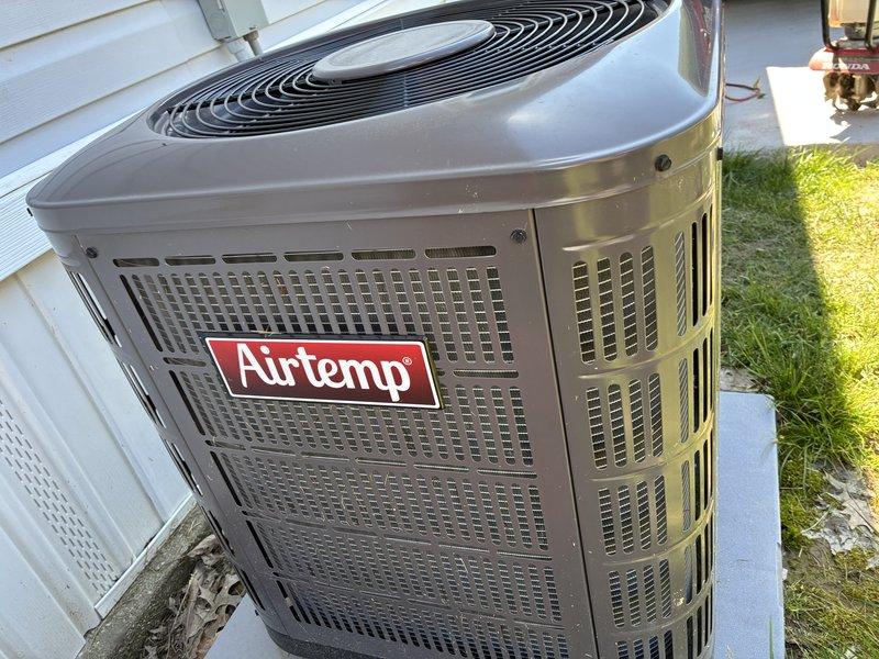 Returned to property to perform refrigerant leak search on Airtemp outdoor condensing unit as previously requested. Utilized electronic leak detector to systematically check all refrigerant connections, coil sections, and service ports. Testing equipment registered reading of 22.2 during diagnostic process, confirming presence of refrigerant leak requiring repair.