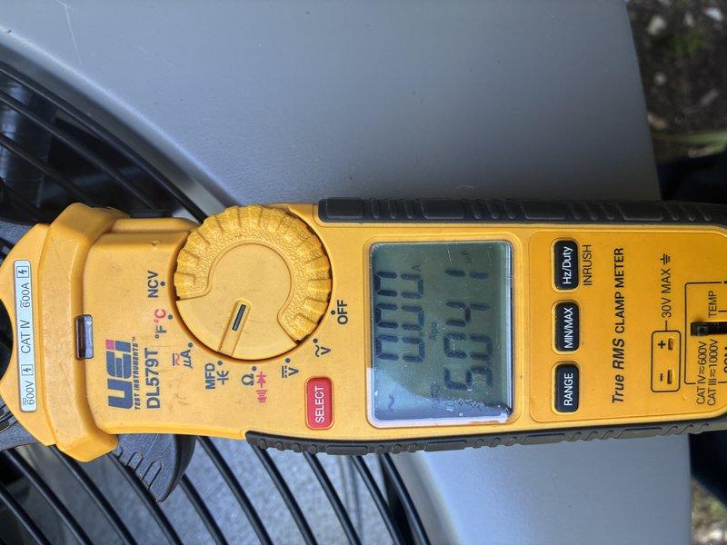Performed routine maintenance on a four to five year old air conditioning system. Inspected outdoor condenser unit, including air intake grille which showed normal dust accumulation. Utilized digital clamp meter to verify electrical readings and system amperage, confirming unit is operating within manufacturer specifications. All components functioning properly with no immediate service needs identified.
