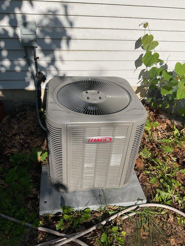 Performed coil cleaning service on residential Lennox outdoor condensing unit. Condenser coils were previously identified as dirty during tune-up inspection and required cleaning to restore proper heat transfer and system efficiency. Cleaned condenser coils, verified unit operation, and restored system to proper working condition.