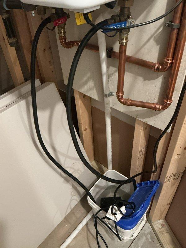 Performed routine maintenance flush on a 3-year-old Navien tankless water heater to remove mineral buildup and maintain optimal performance. Connected descaling pump with flushing solution to the unit's service valves, circulated cleaning solution through the heat exchanger for the manufacturer-recommended duration, and thoroughly rinsed the system. Unit tested successfully after service with proper flow rates and temperature output restored.