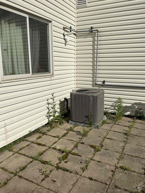Conducted on-site electrical assessment for residential standby generator installation in limited-use backyard area near existing main electrical panel. Evaluated placement constraints due to restricted installation zone, confirmed proximity to breaker panel for efficient transfer switch connection, and documented existing conditions including concrete paver patio surface and available clearances from structure and HVAC equipment. Provided estimate for complete generator system installation with ongoing maintenance contract options.