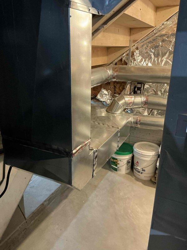 Conducted on-site assessment for complete HVAC system replacement in residential property. Customer requested estimates for new furnace and air conditioning equipment rather than repairs to existing system. Evaluated current basement mechanical installation including existing furnace, ductwork configuration, and air distribution system. Documented equipment locations, duct routing through exposed joists, and available space for new equipment installation. Prepared two separate replacement options for complete heating and cooling system upgrade.