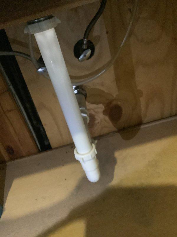 Responded to service call for leaking kitchen and bathroom sinks sharing a common wall. Upon arrival, performed diagnostic inspection of both drain assemblies and identified defective P-trap connections and deteriorated drain fittings causing water leakage beneath both fixtures. Contacted customer to review repair options and received authorization to proceed. Replaced white PVC drain pipe assemblies including P-traps, tailpieces, and connecting fittings for both kitchen and bathroom sinks. Tested all connections for proper drainage and verified leak-free operation. Documented completed installation with photographs showing new plumbing configuration and cleared work area.