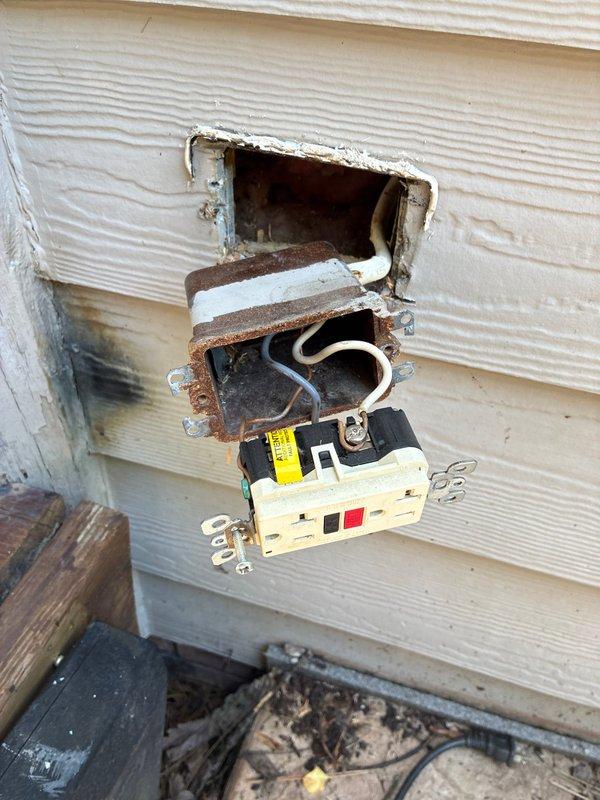 Responded to emergency call for outdoor GFCI outlet that experienced arcing and sparking incident. Upon arrival, found existing outlet installation with severely corroded metal electrical box, deteriorated weatherproof housing, and compromised wire connections due to prolonged moisture exposure. Removed damaged GFCI receptacle and corroded junction box from exterior wall. Installed new weather-resistant electrical box with proper sealing, replaced all compromised wiring, and installed new GFCI outlet with appropriate weatherproof-in-use cover rated for outdoor applications. Verified proper ground fault protection functionality through testing of trip mechanism. Additionally installed second outdoor receptacle at separate location on property as requested, ensuring compliance with exterior outlet spacing requirements and proper GFCI protection for outdoor circuits.
