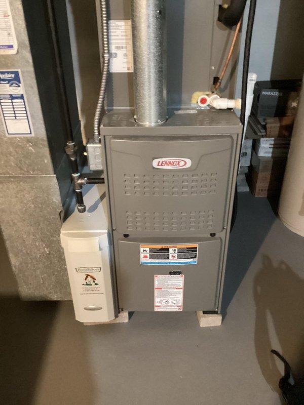 Completed MVP recurring cooling maintenance visit on residential HVAC system. Performed comprehensive inspection of Lennox furnace unit, associated ductwork, humidifier assembly, and electrical components including fuse panel and disconnect. All equipment photographed and documented as operating within normal parameters with no deficiencies noted at time of service.
