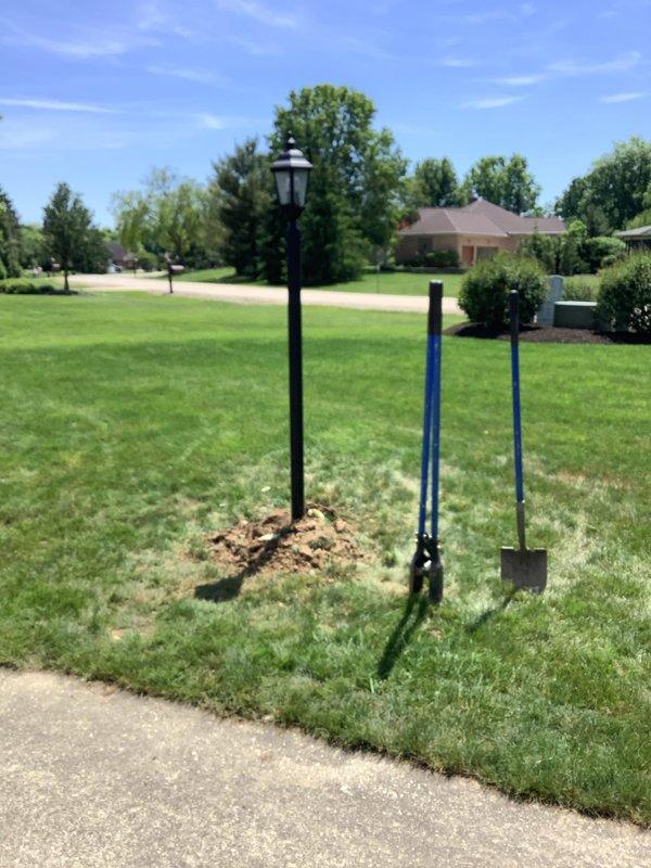 Replaced three customer-supplied post lights that were causing breaker trips due to damaged underground wiring from a fallen post. Excavated existing posts, inspected and repaired damaged wiring, installed PVC conduit for wire protection, and cemented new posts into place. All fixtures were tested and confirmed operational upon completion.
