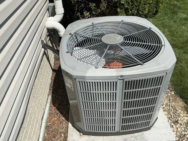 Conducted on-site assessment of 16-year-old residential air conditioning system for replacement estimate. Evaluated existing outdoor condenser unit condition, documented equipment specifications, and photographed current installation including unit placement, refrigerant line routing, and condensate drainage configuration to provide comprehensive replacement proposal.
