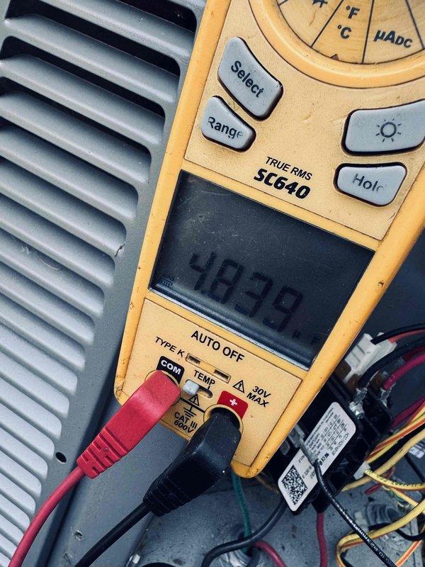 Completed comprehensive tune-up on 5-year-old air conditioning system as rescheduled per customer's availability requirement. Performed diagnostic testing using calibrated multimeter to verify electrical readings and system performance parameters, with measurements indicating proper voltage levels at 587V and temperature differentials within acceptable range. All routine maintenance tasks completed successfully with system operating efficiently.