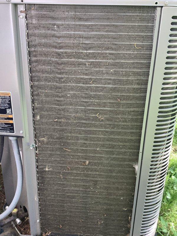 Completed annual maintenance on 2-year-old natural gas HVAC system. Inspected outdoor condenser unit and found evaporator coils heavily obstructed with dirt, dust, and debris accumulation between fins, requiring immediate cleaning to restore proper airflow and system efficiency. Evaluated ductwork condition and recommended professional duct cleaning service to improve indoor air quality and system performance.