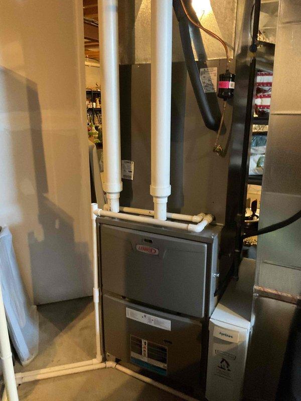 Completed MVP recurring cooling maintenance visit on residential Lennox HVAC system. Performed comprehensive inspection of furnace unit, verified proper operation of ventilation system including PVC intake and exhaust piping, checked ductwork connections and airflow throughout black flexible and metal duct runs, and confirmed all electrical components and controls functioning within normal parameters. System operating efficiently with no issues identified.