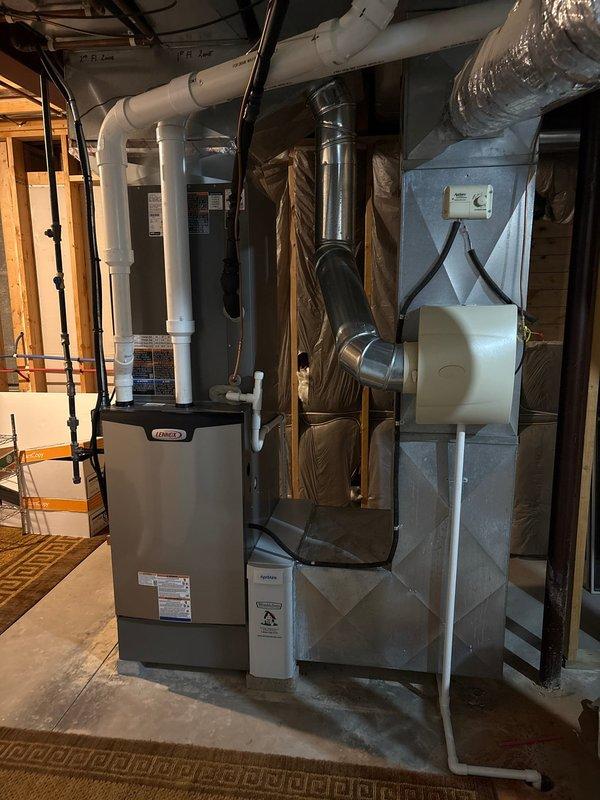 Completed installation of a 5-ton complete HVAC system including furnace and air conditioning unit. Mounted furnace on elevated platform per specifications, installed evaporator coil with protective wrapping, and connected all ductwork including metallic supply and return ducts. Installed new carbon monoxide alarm for safety compliance, ran PVC venting for furnace exhaust and intake, and completed all electrical connections. System tested and verified operational at 90% efficiency rating.