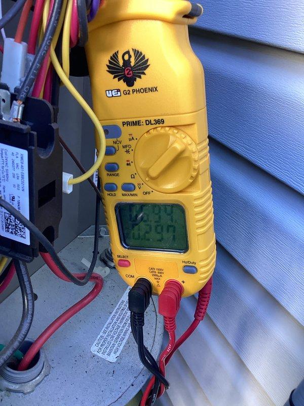 Performed comprehensive AC tune-up including system diagnostics and performance verification. Utilized digital multimeter to test electrical components, capacitor values, and voltage readings at the outdoor unit to ensure proper operation. Inspected air filter condition, noting accumulated dust and debris on the 16x25x1 Filtrete filter, and confirmed proper installation in return air plenum.