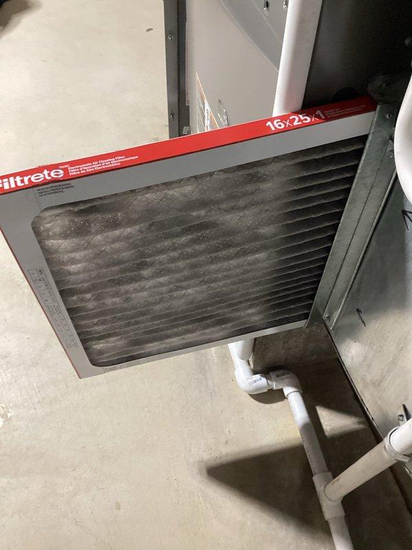 Performed comprehensive AC tune-up including system diagnostics and performance verification. Utilized digital multimeter to test electrical components, capacitor values, and voltage readings at the outdoor unit to ensure proper operation. Inspected air filter condition, noting accumulated dust and debris on the 16x25x1 Filtrete filter, and confirmed proper installation in return air plenum.