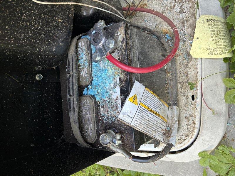 Completed first routine maintenance on Generac whole home generator that had not been serviced since original installation in May 2022. Performed comprehensive preventive maintenance including oil and filter change, air filter inspection and replacement, spark plug evaluation, battery load test, and coolant level verification. Inspected unit for proper operation, checked all electrical connections, and verified automatic transfer switch functionality. Noted significant corrosion and oxidation on exterior housing and internal components, likely due to extended exposure without regular maintenance intervals. Observed copper sulfate crystallization indicating possible coolant leak or condensation issues requiring monitoring. Cleared vegetation growth around unit perimeter to ensure adequate ventilation and airflow to prevent overheating during operation. Tested generator under load, confirmed proper voltage output and frequency regulation, and verified all safety systems operational. Unit