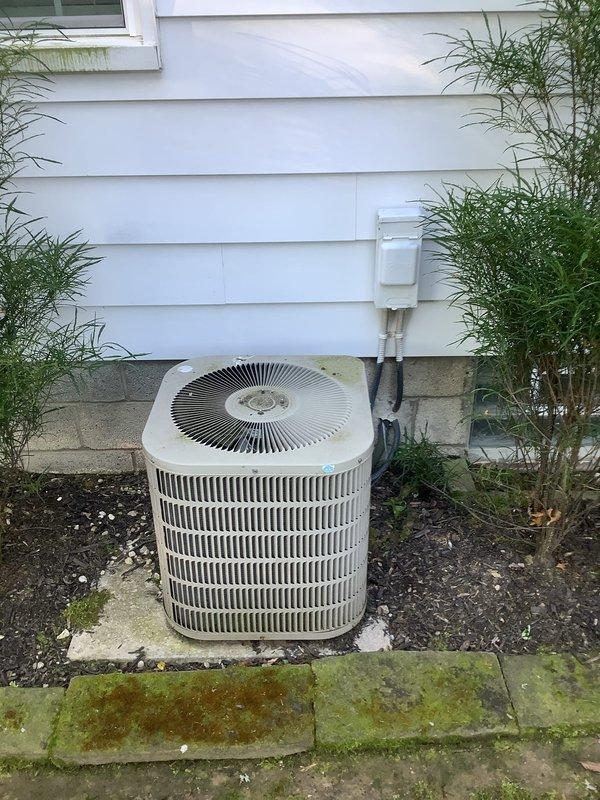 Completed installation of new outdoor air conditioning condenser unit on concrete pad with proper electrical disconnect and refrigerant line routing secured to exterior siding. Installed new evaporator coil system in basement mechanical room alongside existing water heater, including all necessary refrigerant connections, condensate drainage, and electrical controls. All components tested and verified operational upon completion.
