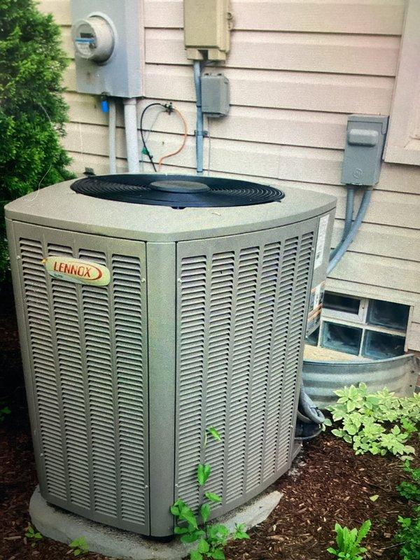 Completed MVP cooling maintenance visit on 5-year-old Lennox air conditioning system. Performed comprehensive inspection of outdoor condenser unit and indoor components, including examination of evaporator coil fins and air filter assembly. Filter showed normal dust accumulation consistent with regular use and was assessed for replacement needs. Inspected heat exchanger coils displaying typical wear patterns for unit age. Verified condenser unit positioning on concrete pad with adequate clearance, noting vegetation growth around perimeter that may require future attention to maintain proper airflow. Documented electrical connections, disconnect box, and meter configuration. Unit operational and functioning within normal parameters for seasonal cooling demands.