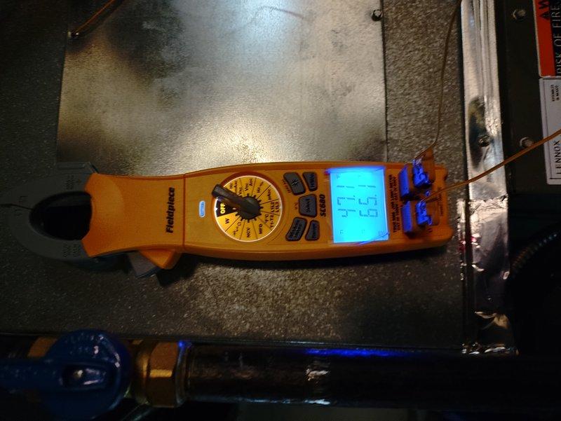 Responded to no-cooling call on recently installed residential AC unit. Upon arrival, found unit attempting to start but failing to run. Removed service panel and performed electrical diagnostics on condensing unit. Measured voltage at capacitor terminals using digital multimeter, which indicated insufficient capacitance at 4.63 microfarads. Identified failed run capacitor as root cause preventing compressor from starting. Replaced defective capacitor with proper OEM replacement, verified correct voltage and amperage readings, and successfully tested unit operation. System now cooling properly with normal startup and run cycle.