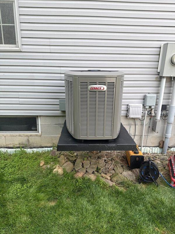 Completed full HVAC system installation including outdoor Lennox air conditioning unit and indoor evaporator coil. Installed condenser on elevated composite pad with proper clearances from structure, secured refrigerant line set and electrical disconnect, and established proper drainage around equipment base. Mounted evaporator coil to existing furnace/air handler in mechanical room, connected refrigerant lines, established proper condensate drainage via PVC piping, and completed all electrical connections. Evacuated system, charged with manufacturer-specified refrigerant, verified proper airflow and temperature differential across coil, and confirmed all safety controls operational.