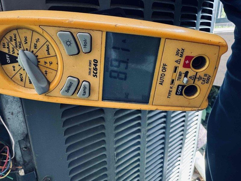 Responded to callback for thermostat operating heating system but not cooling system on equipment installed three months prior. Upon arrival, performed diagnostic testing on outdoor condensing unit using digital multimeter to check electrical values and verify power supply to compressor and condenser fan motor. Inspected control wiring connections at outdoor unit and confirmed proper voltage at disconnect. Tested thermostat communication signals between indoor air handler and outdoor unit to isolate control circuit failure. Identified and resolved issue preventing air conditioning operation while maintaining proper heating function. Verified system restored to full operational status with both heating and cooling modes functioning correctly. Unit tested and left in proper working order.